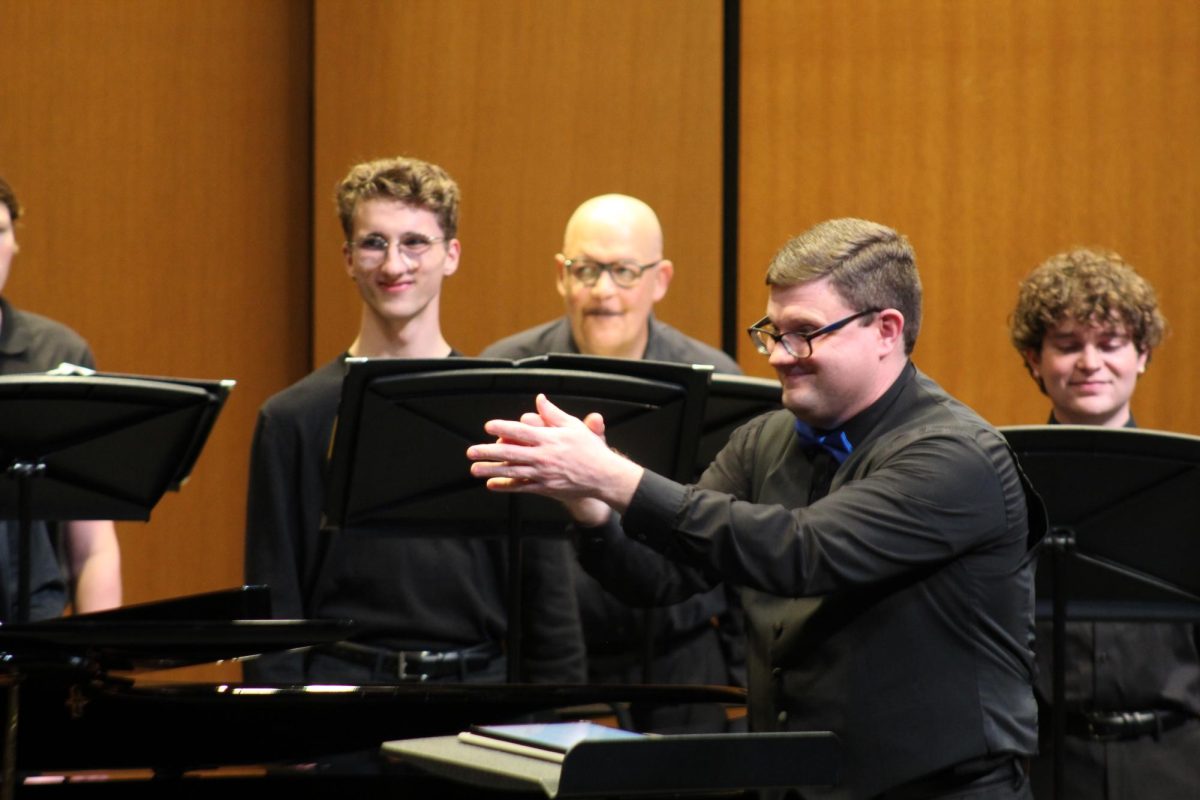 Artistic director Joshua Brown applauds Coppell Chamber Singers after its performance of Johannes Brahm’s “Vier Quartette, Op. 92” on Feb. 25 at Coppell Arts Center. The Coppell Community Chorale premiered its new ensemble, The Coppell Chamber Singers, with its 