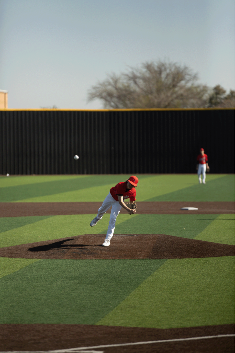 Coppell sophomore Jackson Floren pitches to North Forney on Saturday at Coppell ISD Baseball/ Softball Complex. The Cowboys defeated the Falcons, 5-2.