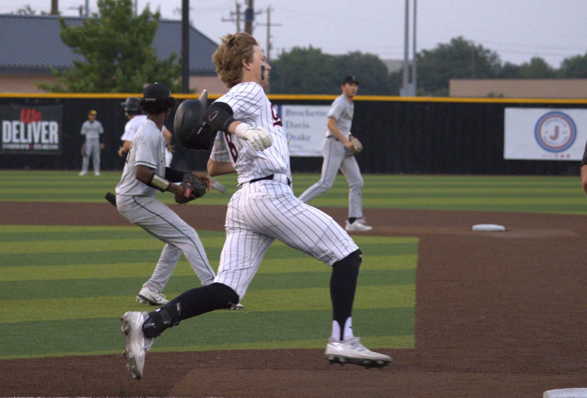 Coppell+senior+outfielder+Brodie+Scott+runs+to+first+base+against+Plano+East.+The+Cowboys+defeated+the+Panthers%2C+6-1%2C+at+the+Coppell+ISD+Baseball%2FSoftball+Complex+on+Friday.+