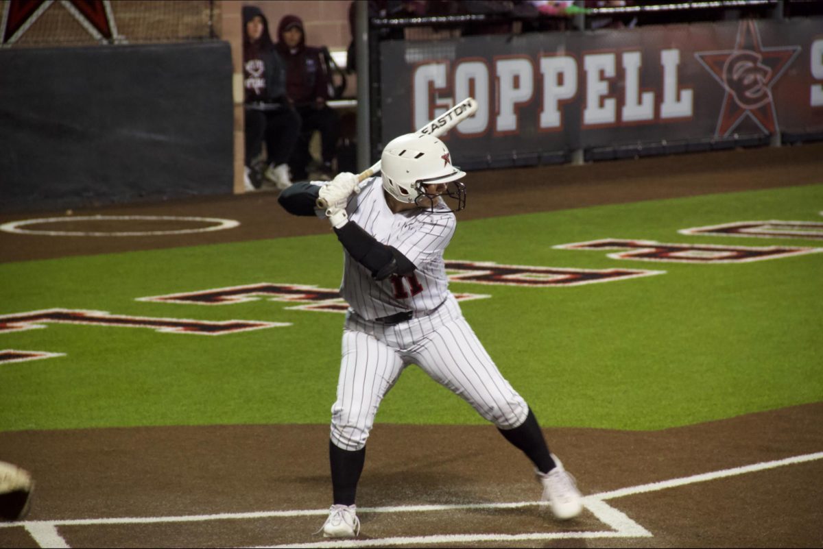 Coppell senior infielder Mallory Moore bats against Lewisville on March 8 at Coppell ISD Baseball/Softball Complex. Moore has played softball for over a decade and is signed to play softball at Emporia State University. Photo by Isheeta Bajjuri