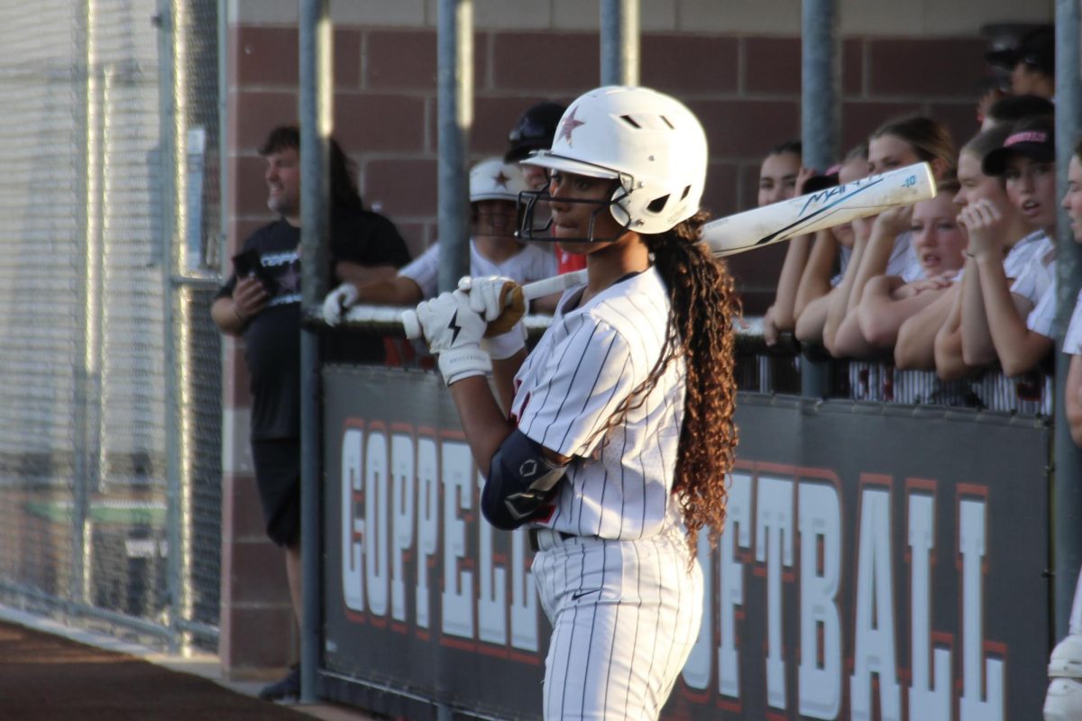 Coppell junior center fielder Nevaeh Carter waits on deck at the Coppell ISD Baseball/Softball Complex on Friday. Hebron defeated the Cowgirls, 12-0.