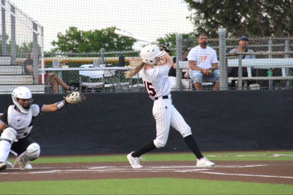 Coppell sophomore third baseman Madison Scott bats during the third inning against Hebron at the Coppell ISD Baseball/ Softball Complex on Friday. The Hawks defeated the Cowgirls, 12-0. 