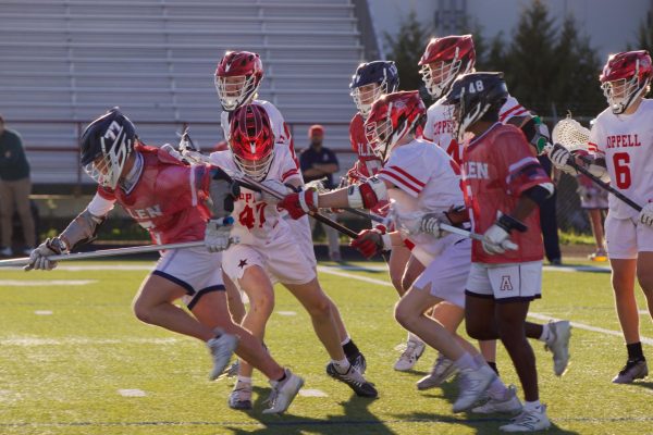 Coppell junior midfield Jack Rasmussen body checks Allen senior attack Keaten Cox as he charges through the Coppell defense at Lesley Field on Tuesday. The Eagles defeated the Cowboys, 9-8. 