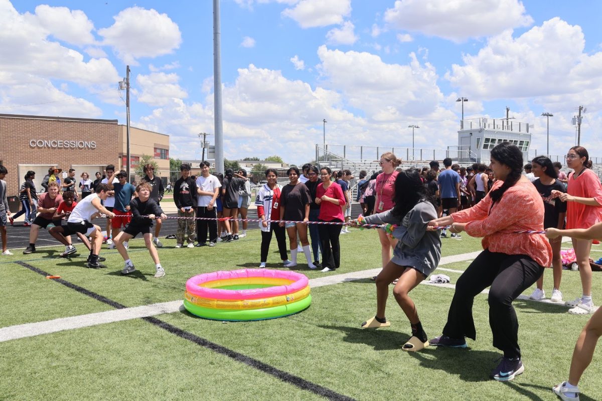 CHS9 students play a game of tug-of-war on the football field on Friday. CHS9 held its fourth annual Cowboy Fest to celebrate the end of the school year and boost school spirit.