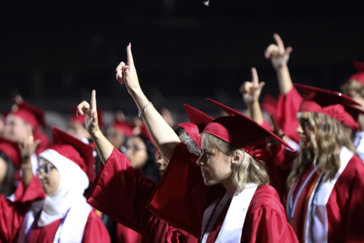 Seniors sing the Coppell High School alma mater during the final moments at graduation on Friday at Buddy Echols Field. Coppell High School held its graduation ceremony for the Class of 2024.