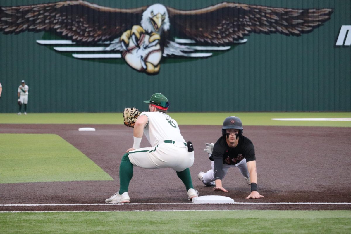 Coppell+senior+Brodie+Scott+dives+to+make+it+back+to+first+base+as+Prosper+first+place+Jordan+Fernandez+makes+the+tag+on+a+pickoff+attempt+on+Friday+night+during+Game+2+of+the+Class+6A+Region+I+bi-district+best-of-three+series.+Prosper+won+Games+2%2C+10-0%2C+and+Game+3%2C+13-1%2C+on+Saturday+at+Coppell+ISD+Baseball%2FSoftball+Complex+to+take+the+series.