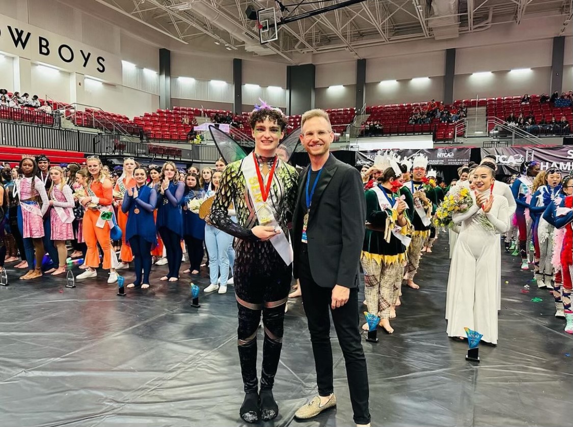Coppell High School senior Parker Jones accepts his award for performer of the year with North Texas Colorguard Association president Arthur Grossman on April 7 at CHS Arena. This is the first year NTCA has had the Scholastic Performer Award. Photo Courtesy Parker Jones
