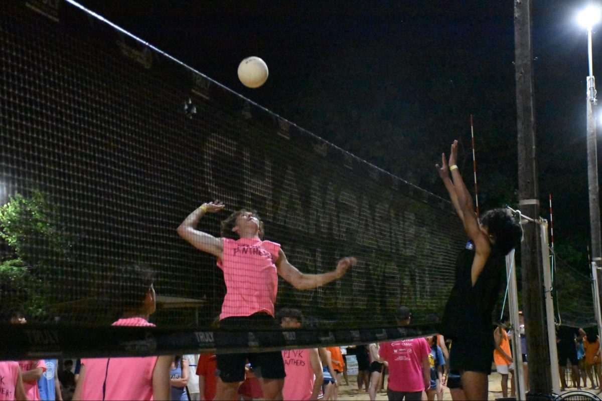 Coppell sophomore Brooks Kaiser spikes to score the winning point against UNC Status. The Pink Panthers won a narrow victory against UNC Status, 10-9. The Coppell volleyball hosted its 22nd annual sand volleyball tournament where students compete in teams to raise money for the program.