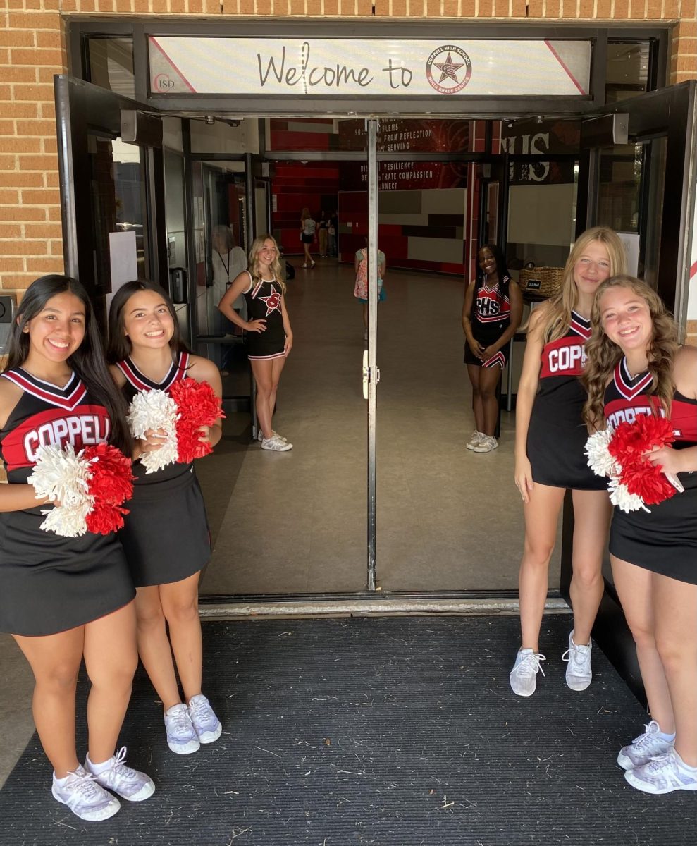 On Wednesday, Coppell High School and CHS9 cheerleaders line the doors of CHS9 as they welcome students into the campus. CHS9’s first day of school served as a time for students to find their place in the campus.