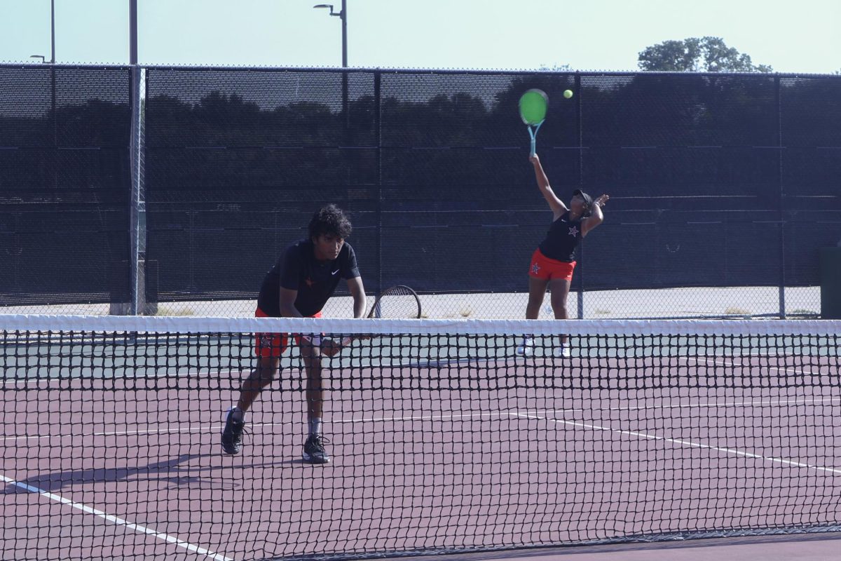 Coppell senior Lakshita Yuvaraja serves during her doubles match with senior Anand Palaniappan against Hebron seniors Arvind Kurup and Caroline Coffman on Tuesday. The Coppell tennis team defeated Hebron and Frisco Lebanon Trail, (14-5), at Coppell Tennis Center. 