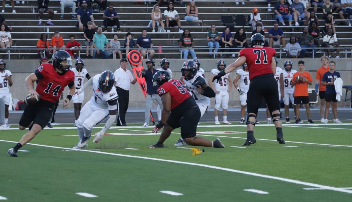 Coppell senior quarterback Edward Griffin evades the defense as the pocket is starting to collapse. Coppell played Sachse on Friday with Sachse losing 31-10.