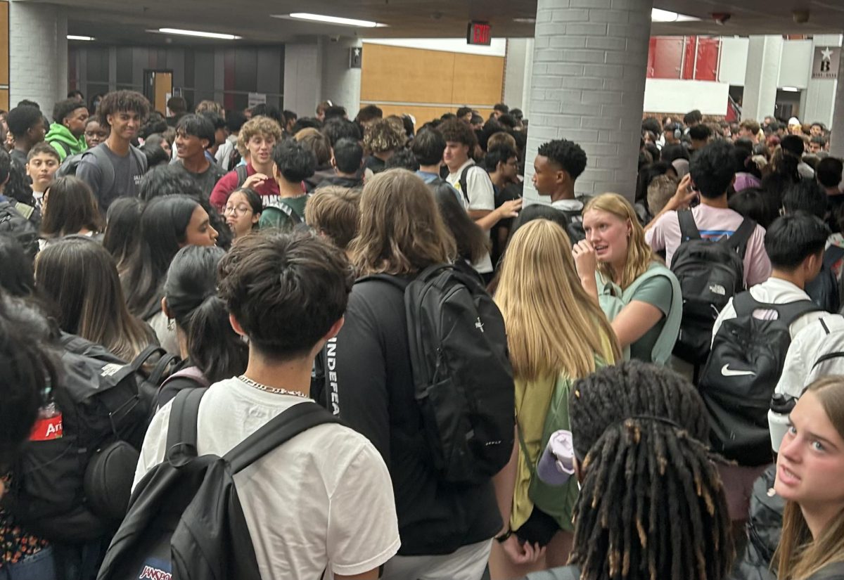 Coppell High School students gather in the hallways to go to their next class during the second passing period on Wednesday. Coppell ISD returned to school for the first day of the 2024-2025 academic year on Wednesday. 