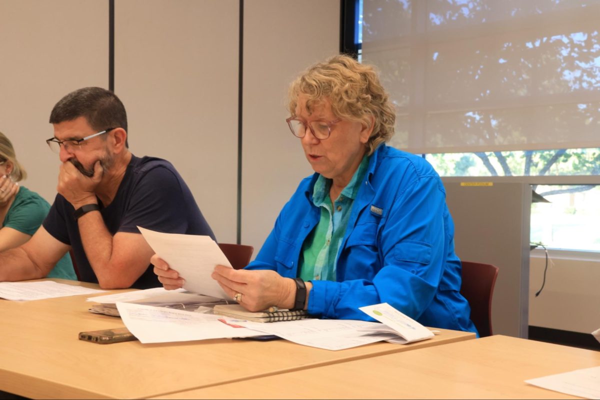 Board of Friends secretary Bobbie Baumgarten and president Steve Charters discuss the details of the Coppell Cozby Library and Community Commons 50th anniversary celebration. The Coppell Board of Friends holds monthly meetings at the Cozby Library.