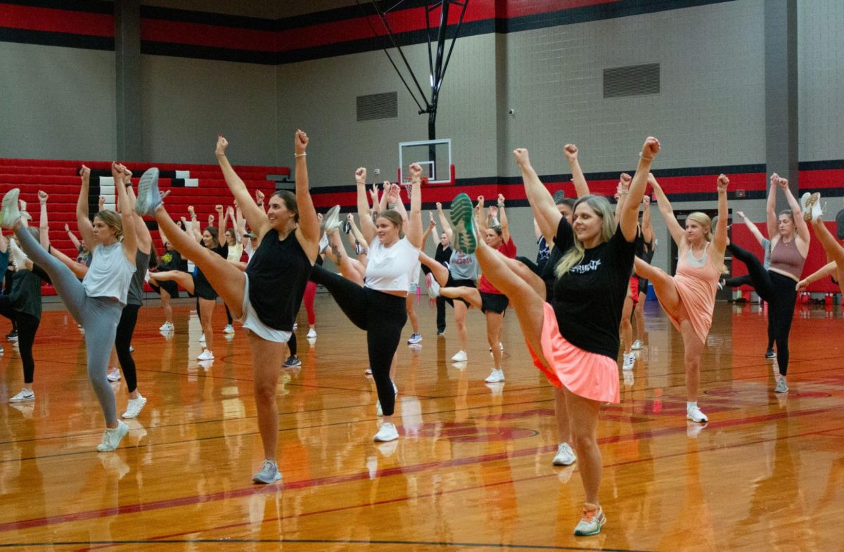 Former Coppell High School Lariettes practice their routine music at CHS Main Gym on Saturday morning. The Lariettes are celebrating their 60th anniversary by hosting a special alumni weekend and performing alongside current Lariettes during Friday’s football game at Buddy Echols Field.