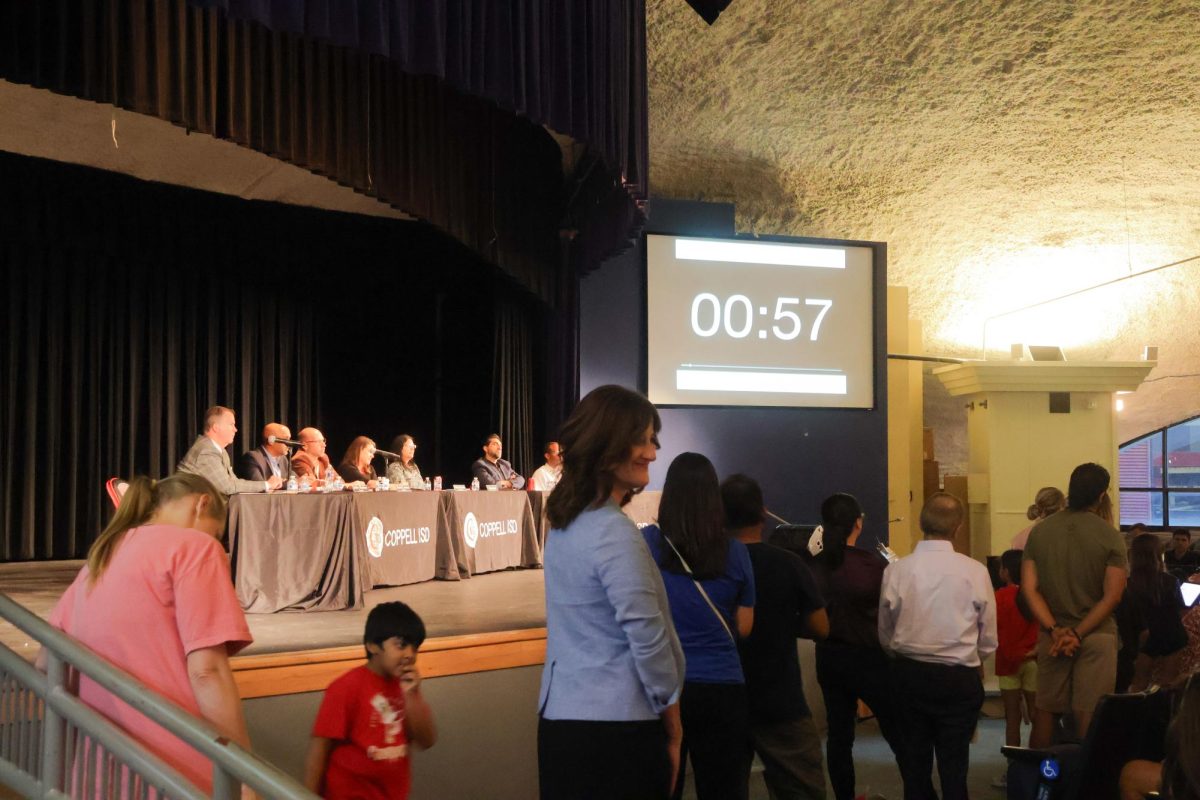 Students, faculty and parents of Wilson Elementary and Pinkerton Elementary Schools wait to speak before the Coppell ISD Board of Trustees to appeal to keep the Pinkerton Elementary School campus open on Wednesday in the CHS9 Auditorium. The board held a town hall meeting to gather thoughts about the remaining consolidation options before decisions will be made on Sept. 30.