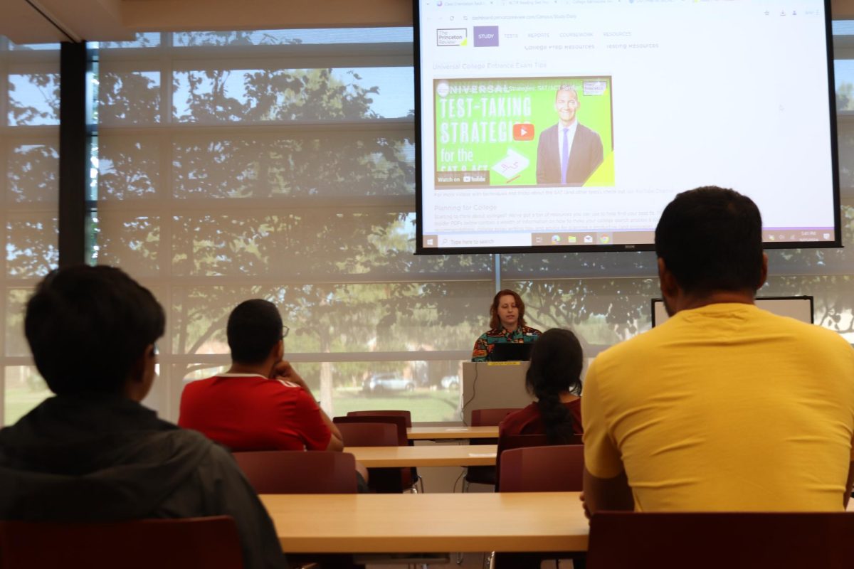 Librarian Bri Praslicka presents SAT and ACT prep tools to students and parents at the ACT and SAT prep resources meeting at the Cozby Library and Community Commons on Wednesday. The meeting allowed parents and students to ask questions and learn about study resources available for the SAT and ACT. 