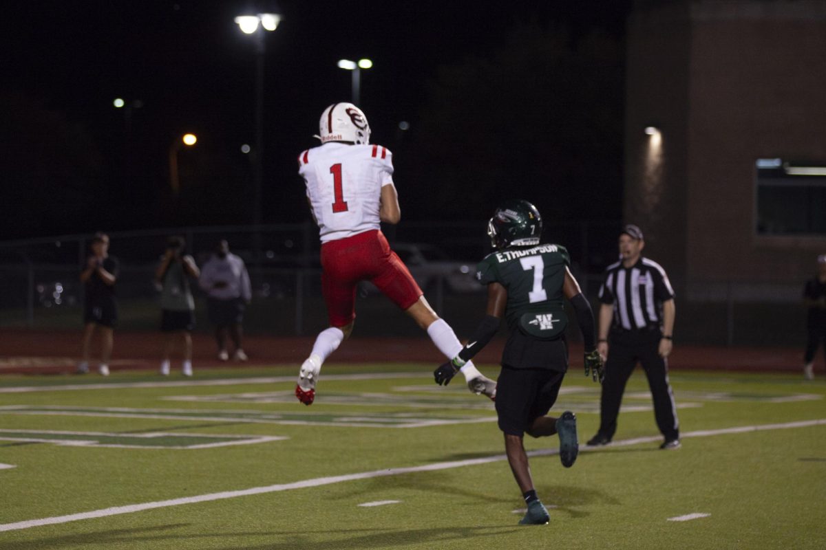 Coppell senior wide receiver Tucker Cusano evades Waxahachie senior cornerback Elijah Thompson as he catches a touchdown at Stuart B. Lumpkins Stadium in Waxahachie on Friday. The Cowboys defeated the Indians, 28-27, in their first overtime game since October 2021.