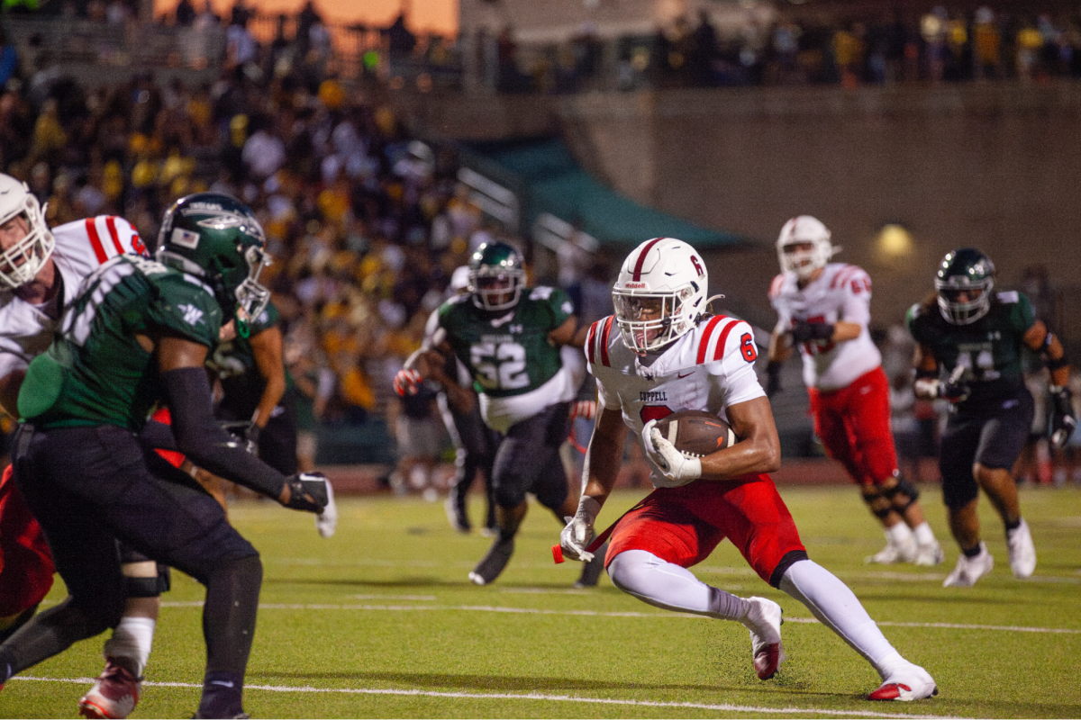 Coppell senior running back O’Marion Mbakwe rushes the field past Waxahachie defense on Sept. 6 at Stuart B. Lumpkins Stadium. The Cowboys play Arlington Bowie at Wilemon Field in Arlington at 7 p.m. on Friday.