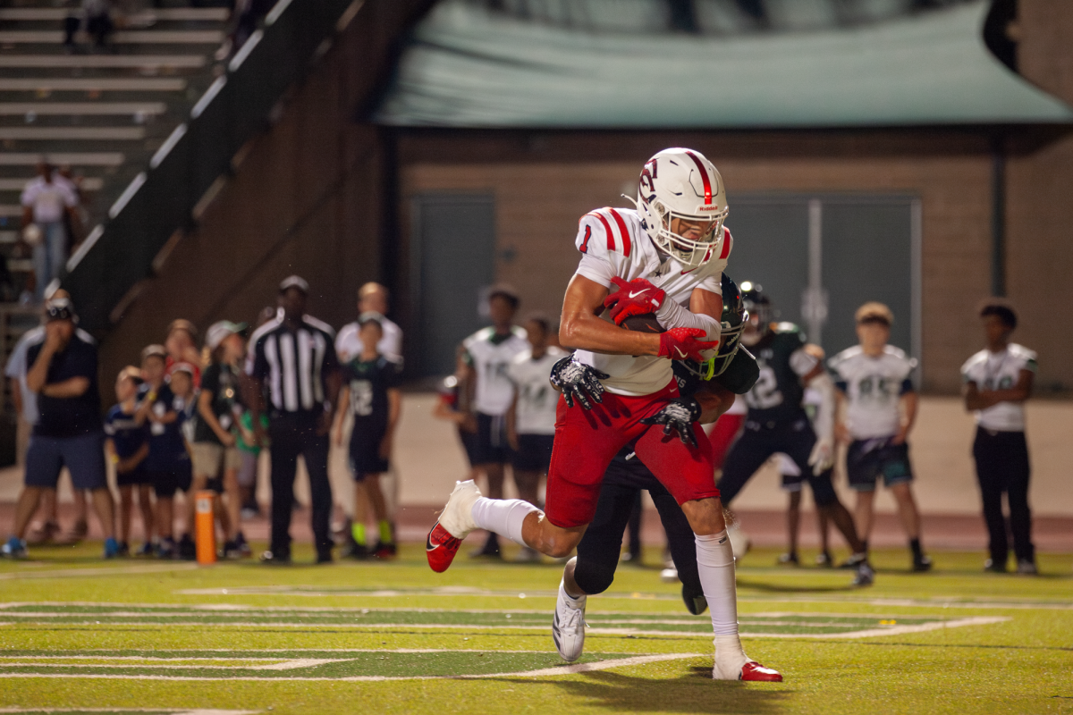 Coppell senior wide receiver Tucker Cusano runs a slant route, catching the ball in stride for the touchdown in overtime on Sept. 6 at Stuart B. Lumpkins Stadium, making the score 27-21 with Coppell leading. The Cowboys defeated Waxahachie, 28-27, in their first overtime game since October 2021. 