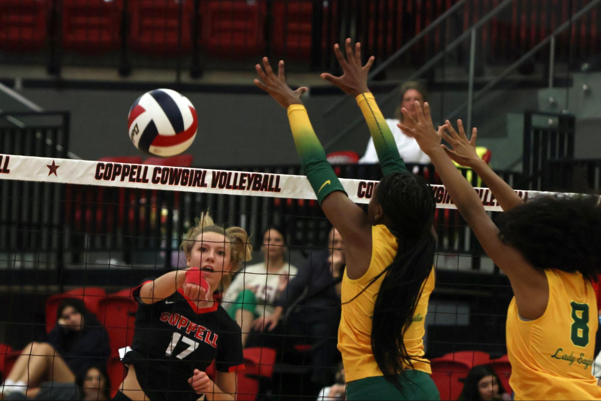 
Coppell sophomore opposite hitter Brooke Felix spikes against Desoto on Tuesday at CHS Arena. The Cowgirls defeated the Eagles, 25-21, 18-25, 25-19, 25-19, after a close match.
