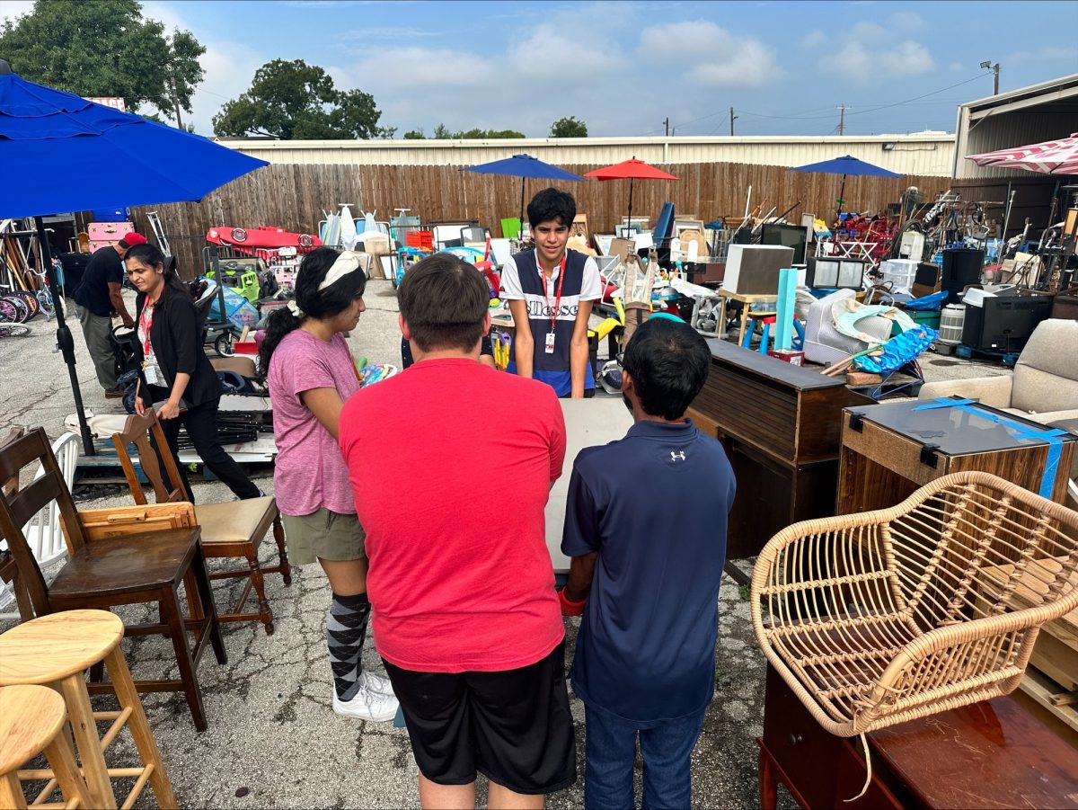 Students from the Coppell ISD’s Skills Training and Employment Program (STEP) volunteer at Graceful Buys, organizing furniture by type. The STEP program aims to serve special education graduates of Coppell High School by developing their independence and sense of responsibility.  Photo courtesy Jonathan Weber 