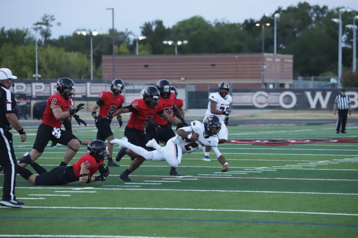 Sachse junior quarterback Dirk Williams Jr. is tripped by Coppell senior linebacker Weston Polk in last week’s 31-10 Cowboys victory at Buddy Echols Field. Coppell plays at Waxahachie on Friday at 7 p.m.