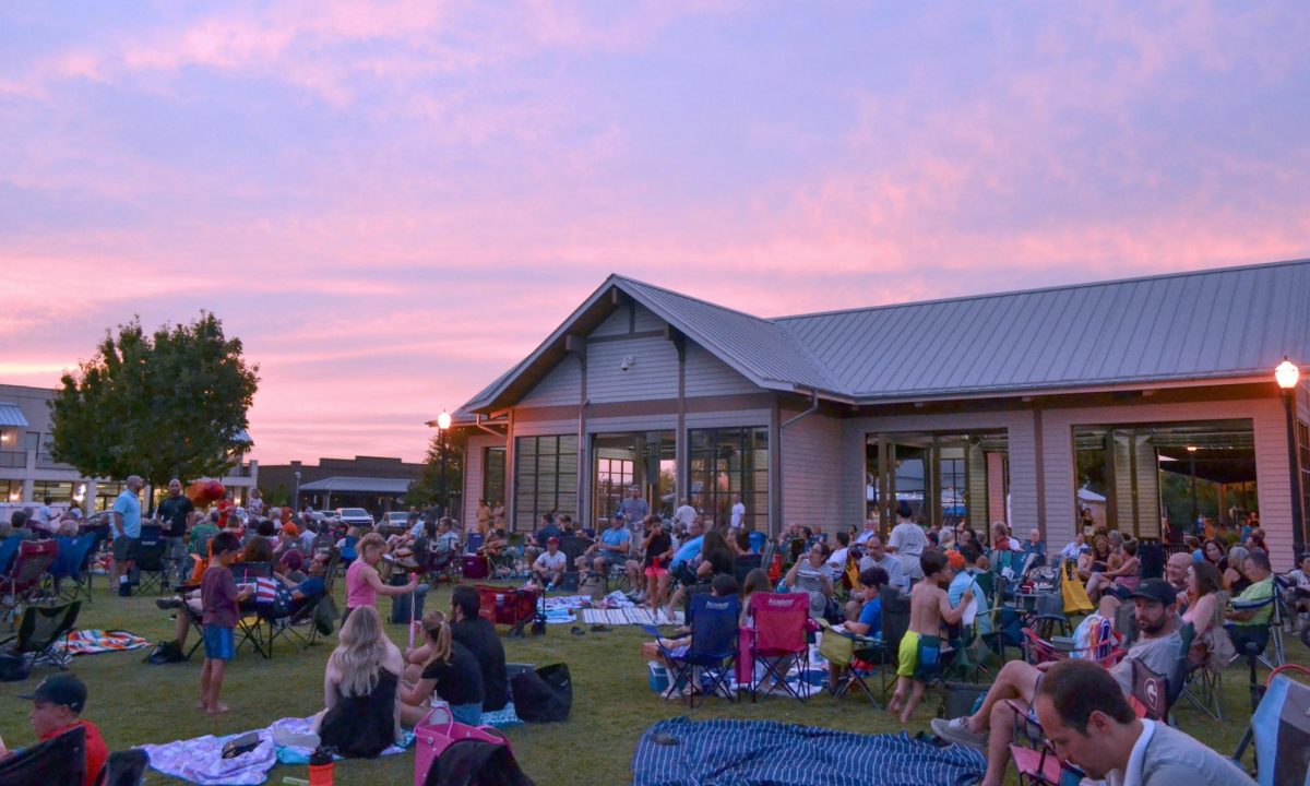 The sunset illuminates the evening sky, creating a calm and relaxing environment on Sept. 14 at Old Town Coppell. Local families gather around at the Sunset Social to partake in community entertainment. Photo by Rachel Chio