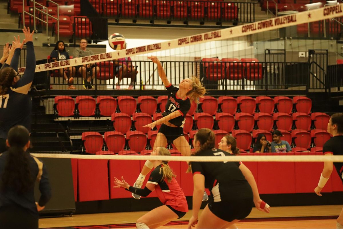 Coppell sophomore outside hitter Brooke Felix spikes during Friday's match against Little Elm in the CHS Arena. The Cowgirls defeated the Lobos, 25-19, 22-25, 25-22, 25-16.