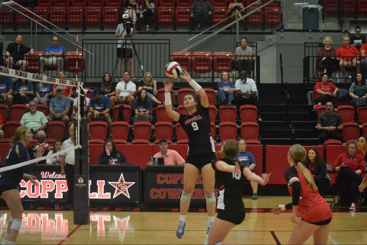 Senior setter Carolina Ufret sets in Friday’s match against Little Elm in the CHS Arena. The Cowgirls defeated the Lobos, 25-19, 22-25, 25-22, 25-16.