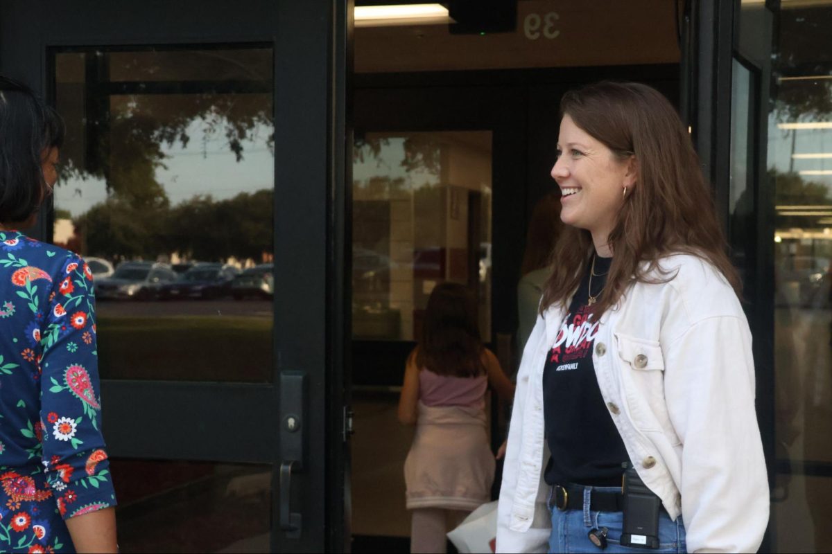 CHS9 English Language Arts and Reading teacher Erin Begle greets parents and students as they arrive at Curriculum Night at the CHS9 campus. Monday’s Curriculum Night introduced parents to their student’s teachers and courses.  