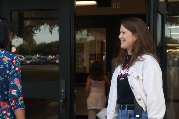 CHS9 English Language Arts and Reading teacher Erin Begle greets parents and students as they arrive at Curriculum Night at the CHS9 campus. Monday’s Curriculum Night introduced parents to their student’s teachers and courses.  