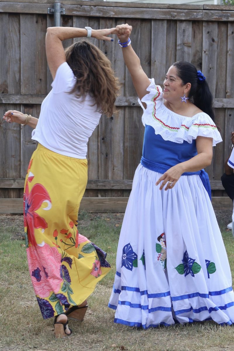 Latino Hispanic Festival attendees dance to live music on Oct. 5 at Coppell Historical Museum. The Latino Hispanic Festival featured displays and performances from South American countries, bringing together families and friends across the community.