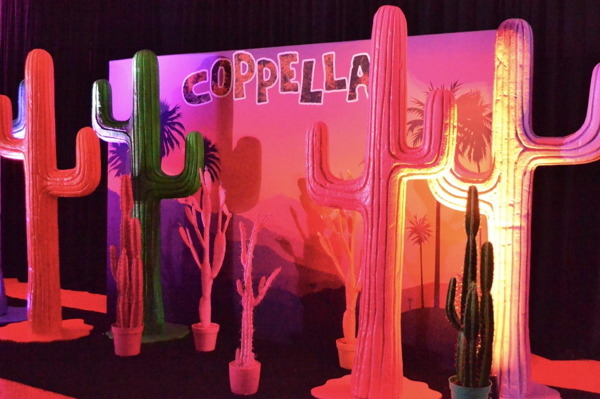 A Coachella-themed backdrop sets the stage for the Homecoming dance on Sept. 28 in CHS Arena. CHS hosted its annual Homecoming dance with a music festival theme. 
