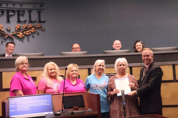 Coppell Mayor Wes Mays awards members of nonprofit organization Pink Soles in Coppell with a certificate proclaiming October as National Breast Cancer Awareness Month. On Tuesday night, the Coppell City Council declared the month of October as Fire Prevention Month and National Breast Cancer Awareness Month.