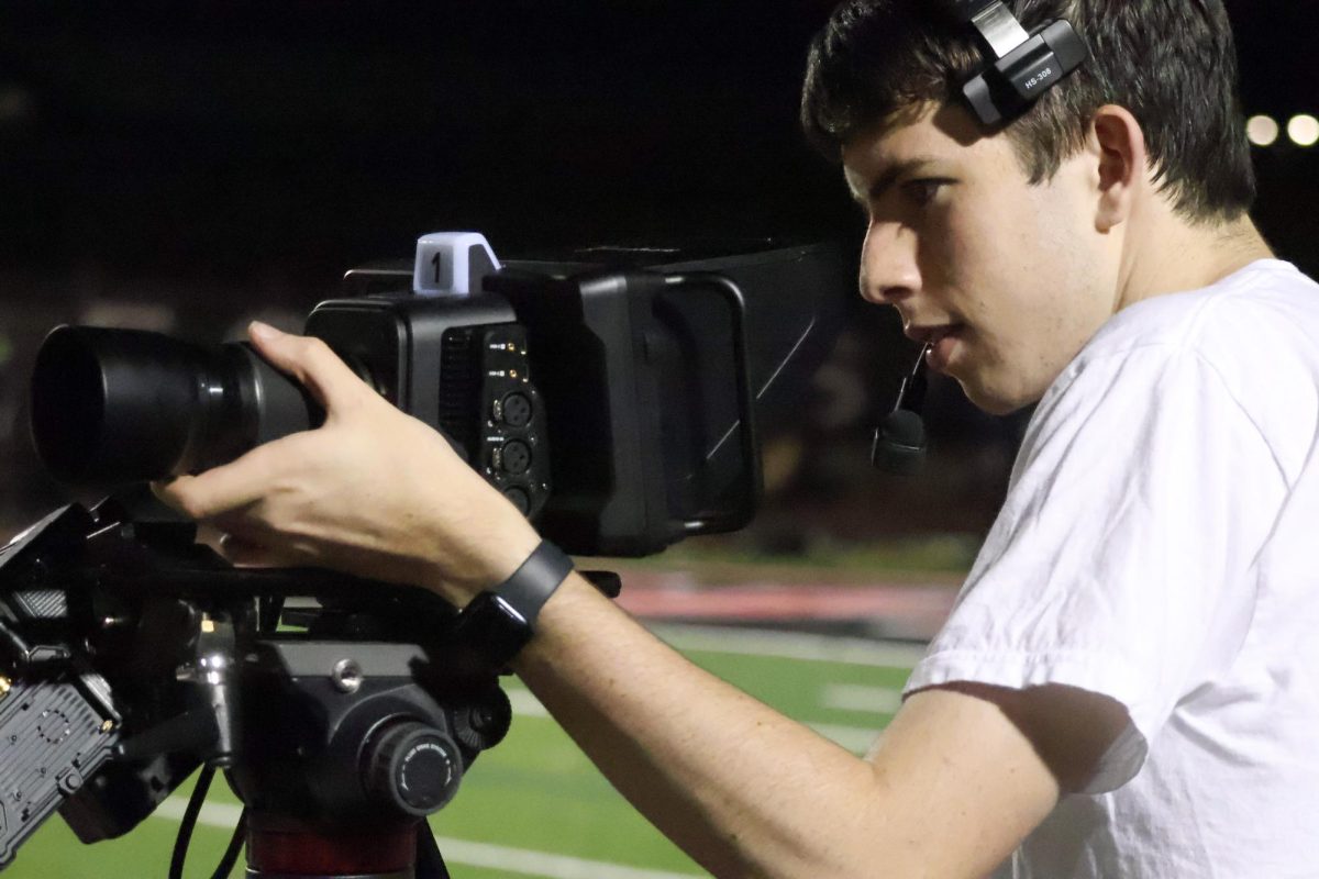 Coppell High School senior Jack Mancuso films Coppell’s home football game against Little Elm at Buddy Echols Field on Oct. 11. Mancuso is an active videographer for both KCBY-TV, Coppell’s student-run TV station, and One Shot Media, his personal videography business. 
