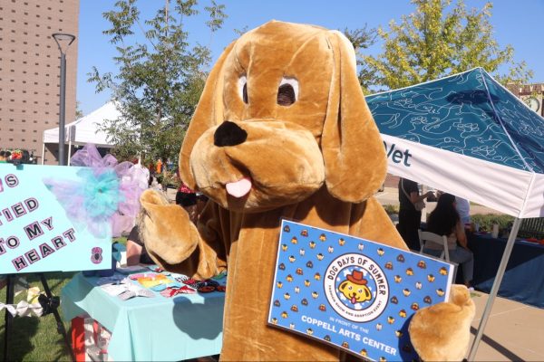 Dog Days mascot Harrison Greenberg socializes with Coppell residents during the Dog Days event. Coppell Arts Center hosted its annual Dog Days: Fashion Show and Adoption event on Oct. 8, providing dog goodies and free microchipping services.