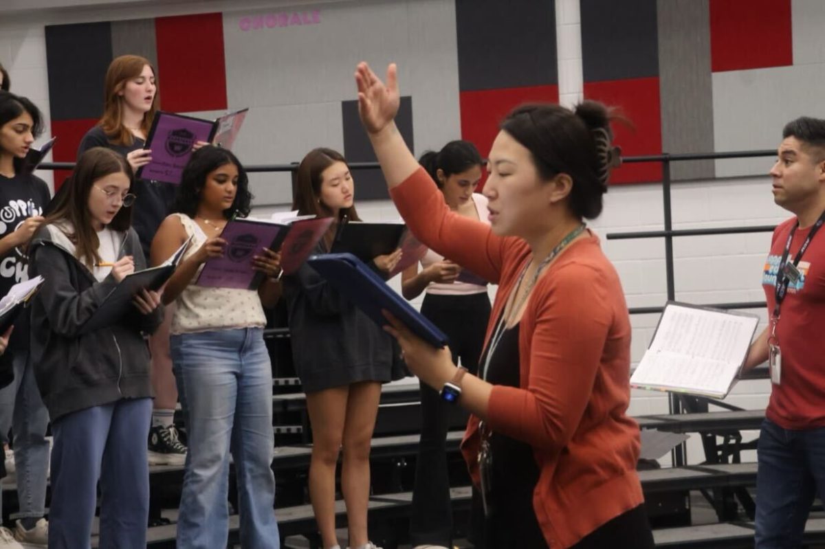 Coppell Choir rehearses for TMEA on Oct. 1 in the choir room. TMEA allows students to develop their musical skills and prepares them to pursue a career in music. 