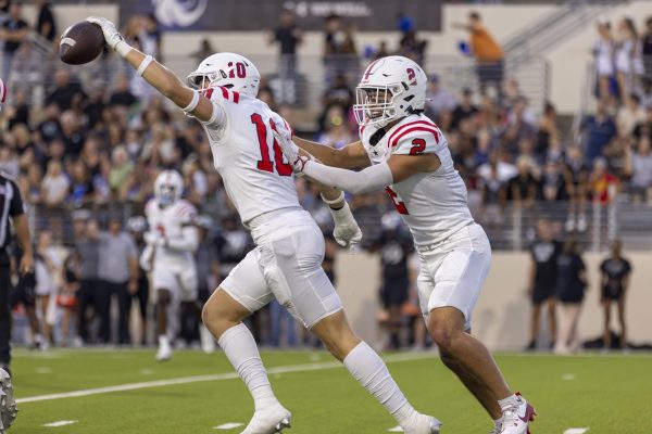 Coppell senior safety Alex Kraus and senior outside linebacker Matthew Neitzel celebrate a fumble recovery against Denton Guyer at C.H. Collins Athletic Complex on Oct. 4. The Cowboys play Lewisville at Max Goldsmith Stadium on Friday at 7 p.m.