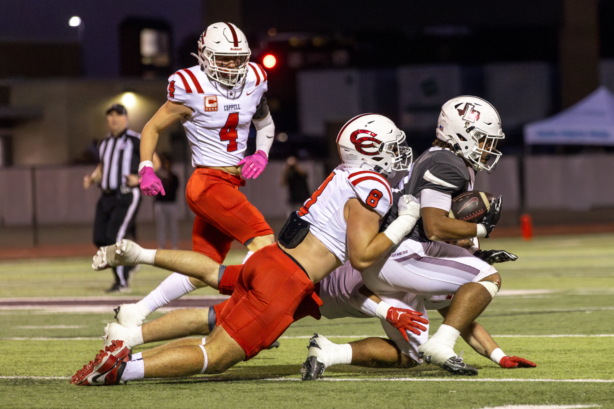 Coppell senior defensive lineman Blake Isbell tackles Lewisville junior running back Tenel Hill at Max Goldsmith Stadium on Oct. 18. Isbell is a crucial piece to the Cowboys defense this year.