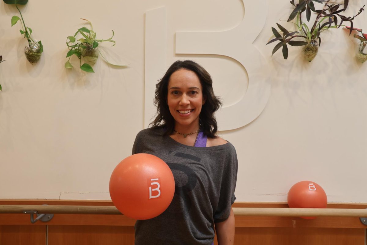 Barre3 owner Kiki Thorn stands in front of her Coppell studio on Oct. 17. Thorn incorporates mindfulness into her fitness routines, helping clients balance physical exercise with mental well-being. Photo by Moukthika Palli