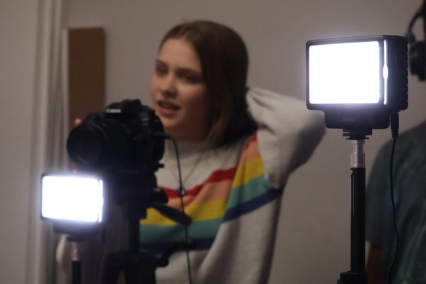 CHS9 student Alexis Hester films the upcoming week’s announcement broadcast. The audio-visual technology class produces campus announcements for the 2024-25 school year. 