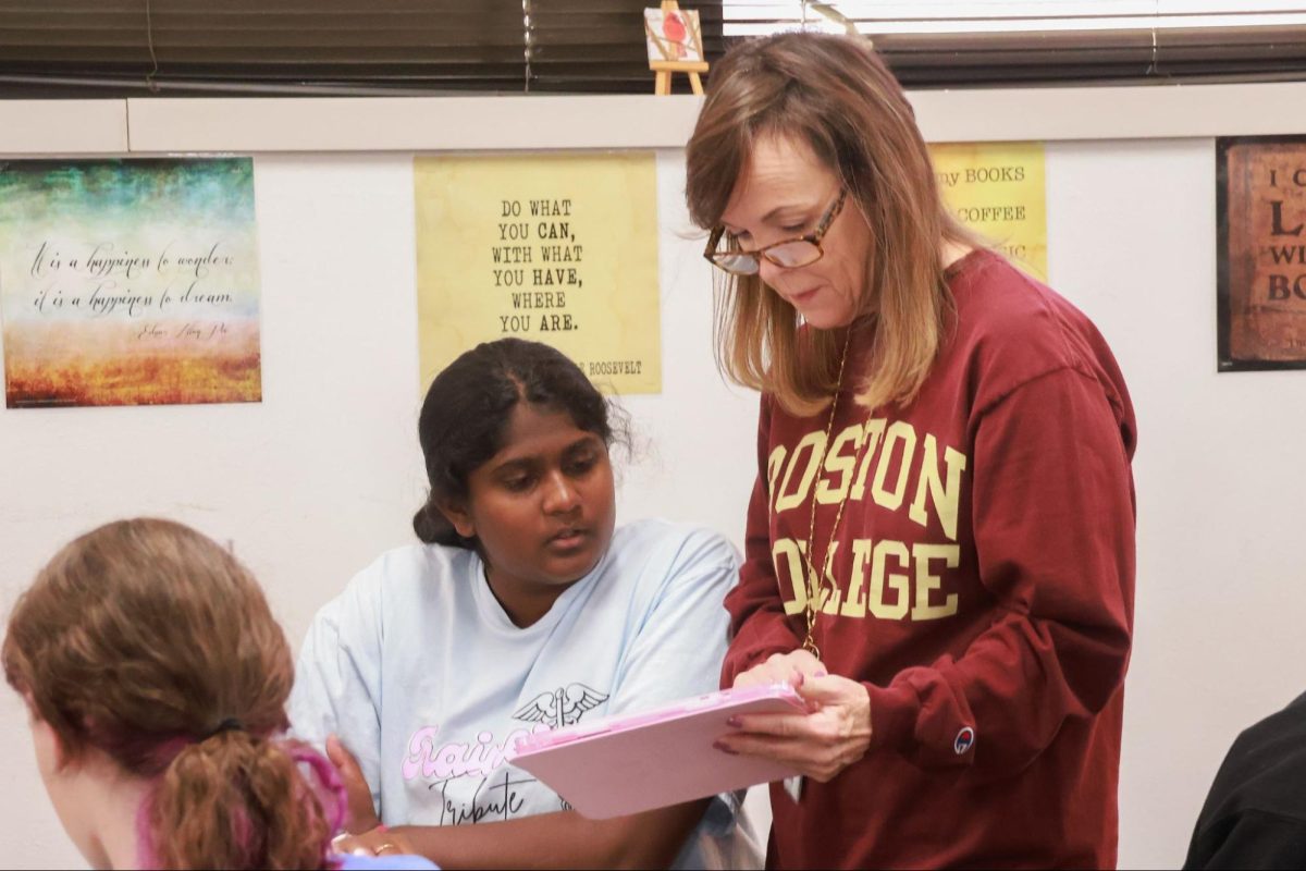 Coppell High School English teacher Laura Salamone helps junior Rhea Guru on Oct. 21. Salamone is passionate about connecting with students and is selected for The Sidekick’s Volume 36 No. 2 Teacher of the Issue. 