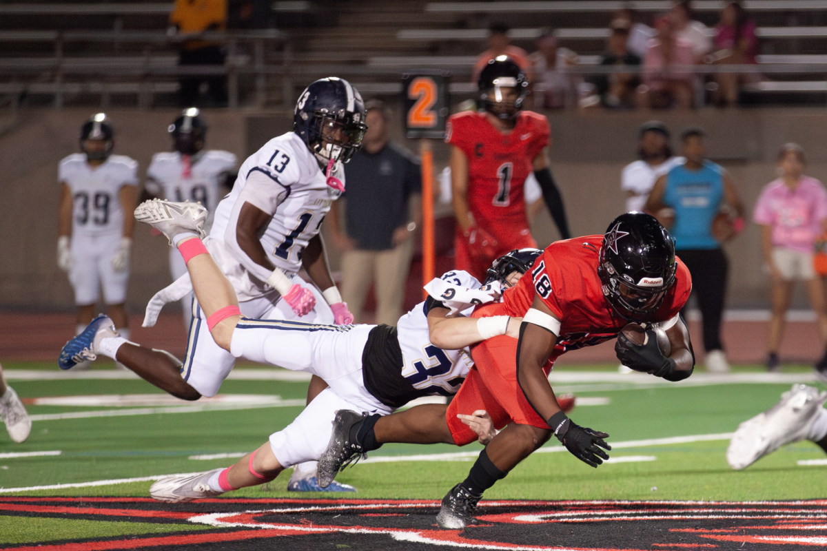 Little Elm senior linebacker Tristan Shelhorse tackles Coppell senior running back Josh Lock on Oct. 11 at Buddy Echols Field. The Cowboys defeated the Lobos, 59-14, bringing their district record to 3-0. Little Elm senior linebacker Tristan Shelhorse tackles Coppell senior running back Josh Lock on Oct. 11 at Buddy Echols Field. The Cowboys defeated the Lobos, 59-14, bringing their district record to 3-0.