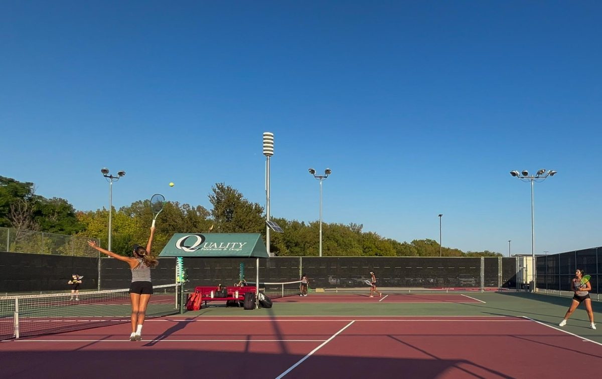 Coppell junior Lexie Patton returns during a doubles match with Coppell freshman Palkin Gangwal against Plano East Jasmine Hart and Ella Perry on Tuesday at the Coppell Tennis Center. Coppell defeated Plano East, 11-3, in the Class 6A Region I bi-district playoffs. 