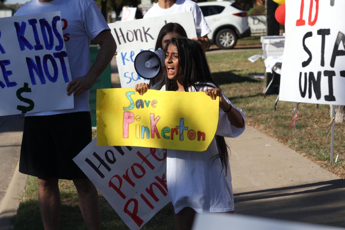 Pinkerton Elementary School fifth grader Niyah Patel protests the consolidation of Pinkerton prior to the Board of Trustees meeting on Monday night at Vonita White Administration Building. The board determined that Pinkerton would be consolidated with other district elementary campuses due to the district’s ongoing budget crisis. Photo by Sukirtha Muthiah