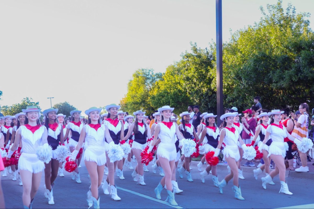 The Coppell High School Lariettes make an entrance for the Homecoming Parade with synchronized dances and cheers. The annual Homecoming Parade took place on Wednesday evening, starting from Parkway Boulevard and ending at Coppell High School.