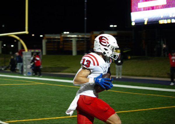 Coppell senior wide receiver Harry Hassman scores a 36-yard touchdown in the second quarter on Friday at Clark Stadium. The Cowboys defeated Lake Highlands, 38-10, in the Class 6A Division I Region I area playoffs on Friday at John Clark Stadium. Photo by Rhea Chowdhary