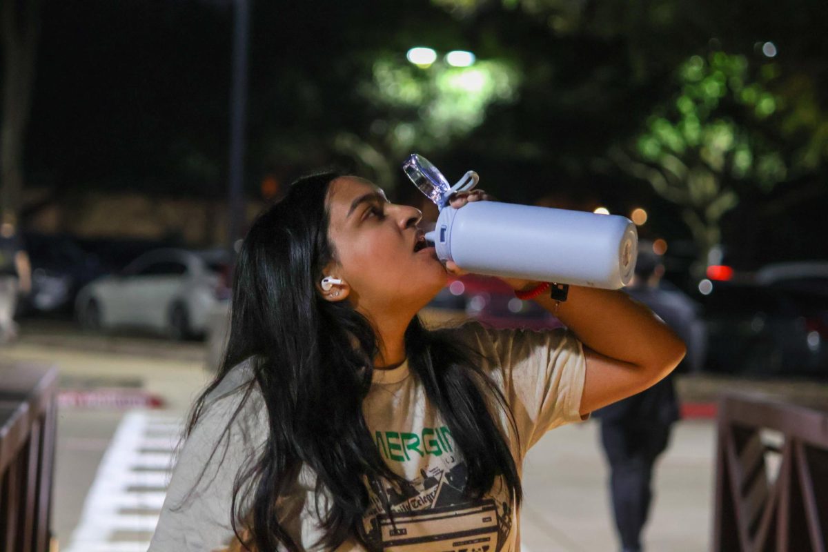 The Sidekick editorial page editor Nyah Rama hydrates herself after a long workout at The CORE on Nov. 12. Rama describes the gym as her new home, allowing her to gain discipline and self-confidence. Photo by Kevin Gunnampalli