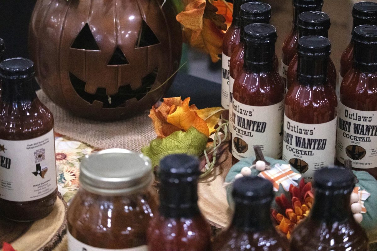 Outlaws’ Most Wanted showcases its cocktail sauces at Holiday House on Sunday in the Coppell High School Commons. Holiday House was open from 11 a.m. to 4 p.m., where local vendors sold products for the holiday season, ticket sales help fund Project Graduation. 