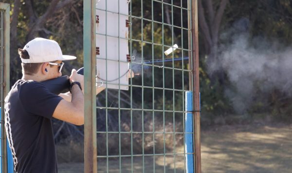 Coppell junior Connor Imwold shoots at clay pigeons while practicing trap shooting at the Grand Prairie Gun Club on Oct. 26. Established in 2011, the shooting team competes in local, state and national tournaments for trap, skeet and sporting clays shooting events.